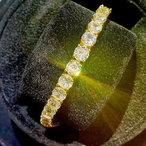 Women's Costume Bracelet with gold and diamond colors.